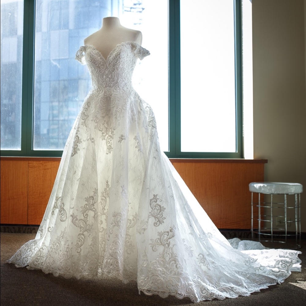 Ivory wedding dress made of beads and factory lace